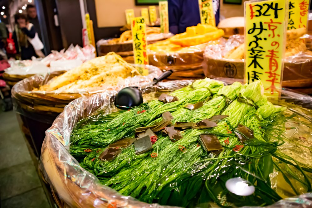 Walkway of the dry leaves in the autumn at Nishiki seafood market,Kyoto,Japan