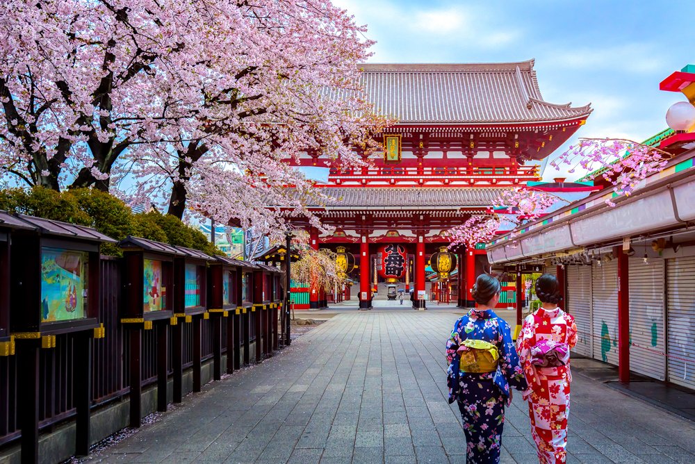 wo geishas wearing traditional japanese kimono among Sensoji Temple in Asakusa Tokyo