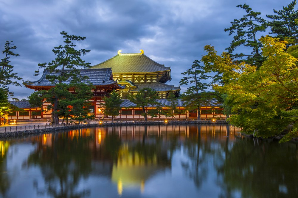 Nara Daibutsu Todai-ji reflecting in a pond after the sunset. This Buddhism temple is hiding the statue of the largest sitting Buddha statue in the world.